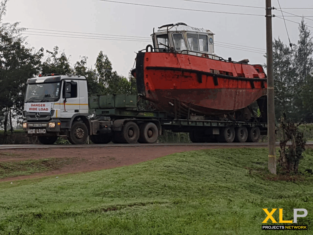 Export Consolidation Services deliver a Wide Load Boat and Heavy Cranes